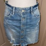 Indigo Rein  medium/light was distressed button front denim mini skirt. Photo 0