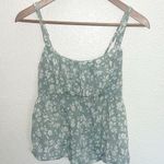 E & M  Juniors Green Floral Babydoll Smocked Back Adjustable Strap Tank Top Photo 0