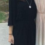 The Comfy Black long sleeve open back romper Photo 0