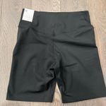 Nike  mid rise tight fit 7” length black dri fit shorts Photo 1