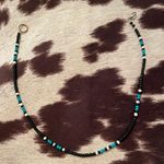 The Dolphin, Blue And Black Choker Multiple Photo 0
