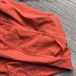 Lululemon  Rise and Flow Pant Mesh Criss Cross Size 4 Orange Coral EUC Photo 9