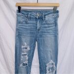 American Eagle  Medium Wash Next Level Stretch Mid Rise Distressed Jegging Jean Photo 2