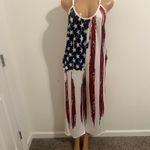 Show your style with this vibrant patriotic jumpsuit, featuring bold red, white, and blue colors. Perfect for any casual outing. Multiple Size M Photo 2