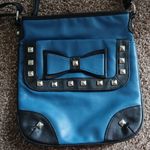 Studed blue bow crossbody purse Photo 1