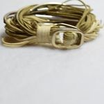 Source Unknown Vintage Gold Tone Tube Multistrand Tan/Cream Cord Toggle Latch Boho Bracelet Photo 1
