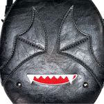 I believe it’s from a company called release the bats crossbody bags! Black Photo 2