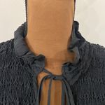 Free People  black Ruffle me up ruffled smocked detail front tie top size S Photo 7