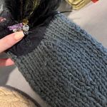 Elegant Gray Knit Headband with Feather Accent Photo 0