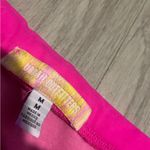 Urban Outfitters  Vibrant Pink Asymmetrical strapless Top Photo 1