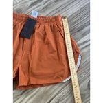 Alphalete  Woman’s Infinity Stride Short W/ Liner - Sour Tangerine, Size Medium Photo 3
