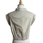 She & Sky #10 Striped Button-Up Cotton Top with Knot Front
This stylish striped button-up cotton top features a trendy knot front design that adds a unique touch to your wardrobe. Made from soft and breathable cotton, it ensures comfort throughout the day. The classic button-up style makes it versatile for both casual and dressy occasions. Pair it with your favorite jeans or skirt for a chic look. Ideal for any season, this top is a must-have addition to your fashion collection. Photo 1