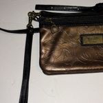 GiGi HILL BRONZE COLORED CROSSBODY OR WRISTLET
HAS BOTH STRAPS
VEGAN LEATHER Brown Photo 4