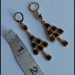 Gold and Black Crystal Tier of Teardrop Dangle Earrings Photo 2