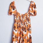 Olivaceous  Orange Floral Off Shoulder Smocked Romper Photo 5