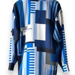 Karl Lagerfeld NWT  Paris Geometric Logo Blouse button up Long Sleeve shirt Blue choose your size msrp $89 All size available  New with tag  Same day shipping  Smoke and pets free  Add a luxurious touch to your wardrobe with this  Paris Geometric Logo Blouse button up Long Sleeve shirt. The shirt features a stylish geometric pattern in blue, black, and white colors, perfect for any occasion. It comes in sizes S/M/L/XL and is made of lightweight, breathable polyester that makes it suitable for all seasons. Super silky flowy.   The shirt's oversized design and packable feature make it a perfect addition to your fashions. The shirt is a part of the Paris Theme and has long sleeves, ideal for the colder months. The shirt is suitable for any size and does not compromise on quality. Photo 4