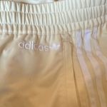 Adidas NWOT  Cream Track/Jogger Pants with ICONIC Side Stripes Size Medium Photo 4