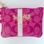 Coach  wristlet with iconic horse and carriage logo. Photo 2