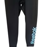 woman’s shiny black with Reebok on leg silver Leggings yoga workout Photo 3
