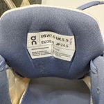 on cloud On Running Women's Athletic Shoes in White, Orange, and Blue Photo 7