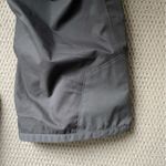 Helly Hansen  medium insulated dark grey snow pants. Adjustable waist and pockets Photo 9