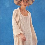 Elegant Cream Knit Swim Cover Photo 1
