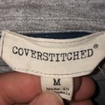 Coverstitched  long in back short in front light weight gray shirt size medium​​ Photo 3