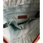 The Sac Embossed Floral Front Leather Shoulder Handbag with Charms. Brown Photo 8