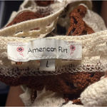 A brown and white long Photo 1