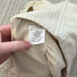 LPA Revolve  cream, textured puff sleeve milk made corset style top Photo 4