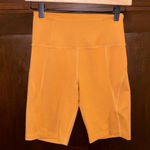 Girlfriend Collective  Saddle High Rise Biker Shorts Rust Orange Brown Yellow Photo 1