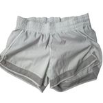 Athleta  womens White Mesh Racer Run Shorts 4" Size Small Gym Athletic preloved Photo 0