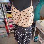 Peppermint Two-tone polka dot dress:
Elegant dress with a strappy design Photo 0