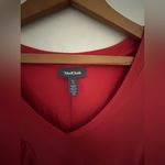 Modcloth rust red tunic with v neck and short sleeves. Sides are longer. Photo 1