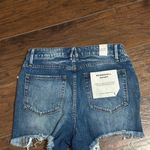 Good American The Bombshell Shredded-Hem Denim Shorts Photo 2