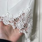 Pins and Needles women’s white embroidered zip stretch shorts XS Photo 1