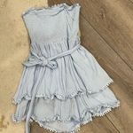 Light blue ruffled tiered smocked strapless romper Photo 1