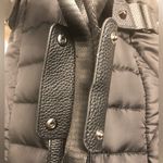 Cynthia Rowley Anthropologie’s Quilted Puffer Travel Bag is a stylish and functional accessory designed for travel enthusiasts. Crafted from high-quality materials, this bag features a quilted exterior for added texture and durability. Its spacious interior provides ample room for belongings, while the thoughtful design includes convenient pockets for organization. The soft puffer style adds a chic touch, making it suitable for various occasions, whether heading to the gym or embarking on a weekend getaway. With comfortable straps for easy carrying, this travel bag combines practicality with fashionable flair. Photo 5