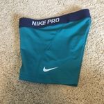 Nike Pro woman’s size XS teal and navy shorts Photo 2