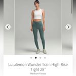 Lululemon  wunder train high rise tight 28”
Sz 4 Medium forest Photo 7
