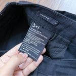 3x1 • Baby Boot cropped flare jeans Black Tear raw hem mid rise stretch denim Photo 6