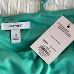 Nine West Side-Tie bow Faux Wrap soft teal color mini dress with a casual summer vibe Med Photo 3