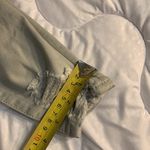 American Eagle Size 00 Super Strechy off white Jeans. Lots of Holes Photo 4