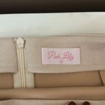 Pink Lily Tan suede mini skirt. Photo 1