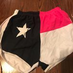 Women’s Texas flag running shorts Pink Size L Photo 0