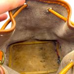 Dooney & Bourke Authentic tan brown pebbled leather drawstring bucket bag … Photo 11