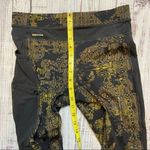 Lole  Burst Black and Gold Print Ankle Leggings. Size Small. EUC Photo 9