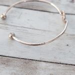 Very Light Shade of Rose Gold Tone Knot Bracelet Photo 6