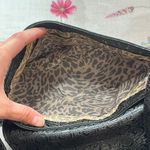 Guess Black Quilted floral Crossbody Bag with cheetah lining and bag charm Photo 3