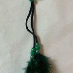 Hair tie with 2 green feather strands Photo 0